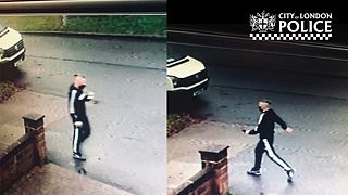 CCTV image of a man wanted in connection with a fake COVID-19 vaccien scam in London.