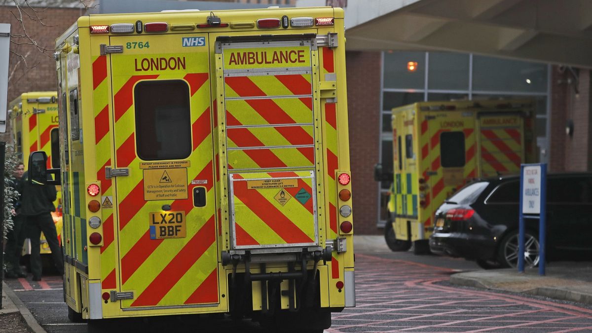 Ambulances are parked at the emergency arrival at Charing Cross hospital in London, Friday, Jan. 8, 2021.