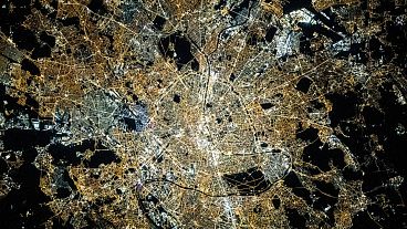 Paris by night with the Seine River flowing through the middle as seen from the International Space Station orbited 423 km above