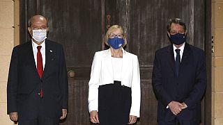 Turkish Cypriot leader Ersin Tatar, left, Elizabeth Spehar, center, head of the United Nations Peace Keeping Force in Cyprus and Nicos Anastasiades, the Greek Cypriot Presiden