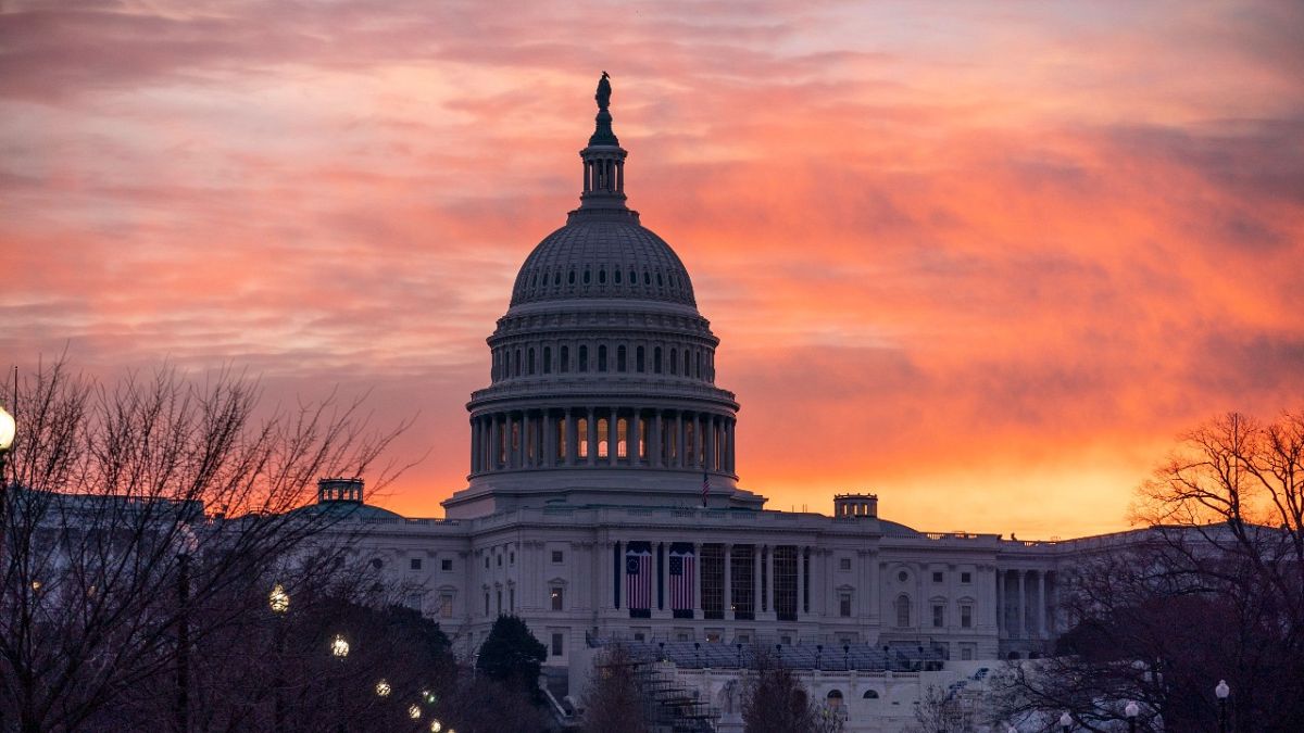 Dawn breaks at the Capitol in Washington, Monday, Jan. 11, 2021.