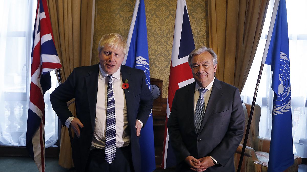 Britain's Foreign Secretary Boris Johnson, left, poses for a photograph with UN Secretary General Antonio Guterres