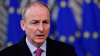 FILE - In this file photo dated Thursday, Dec. 10, 2020, Ireland's Prime Minister Micheal Martin speaks as he arrives at the European Council building in Brussels.