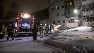 Firefighters work at the site of fire in the city of Yekaterinburg.