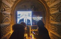 People place candles as they mourn the mayor of Gdansk, Pawel Adamowicz.