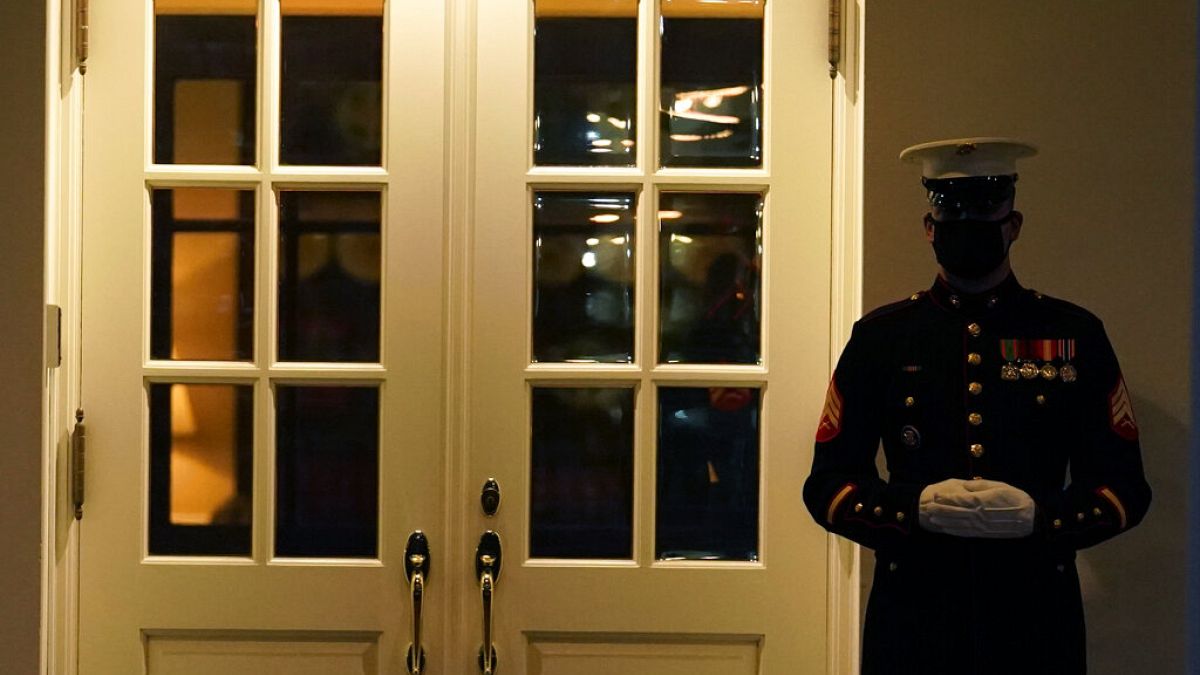 A Marine guard stands at the entrance to the West Wing of the White House, after the U.S. House impeached President Donald Trump in Washington, Wednesday, Jan. 13, 2021. 