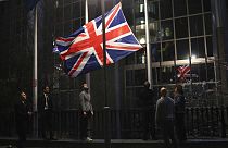 The Union flag is lowered and removed from outside of the European Parliament in Brussels, Friday, Jan. 31, 2020