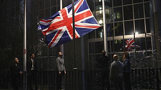 The Union flag is lowered and removed from outside of the European Parliament in Brussels, Friday, Jan. 31, 2020