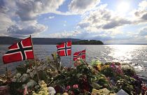 Norwegian flags and flowers are seen in Sundvollen, close to Utøya island.