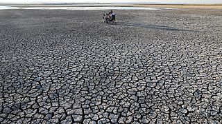 Cracked soil after a drought at Dikilitas Pond in the Golbasi district of Ankara in July 2020.