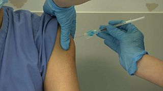 Woman receives moderna Covid-19 vaccine