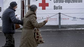 Two persons arrive at a new coronavirus, COVID-19, vaccination center in the 'Erika-Hess-Ice-Stadium' in Berlin