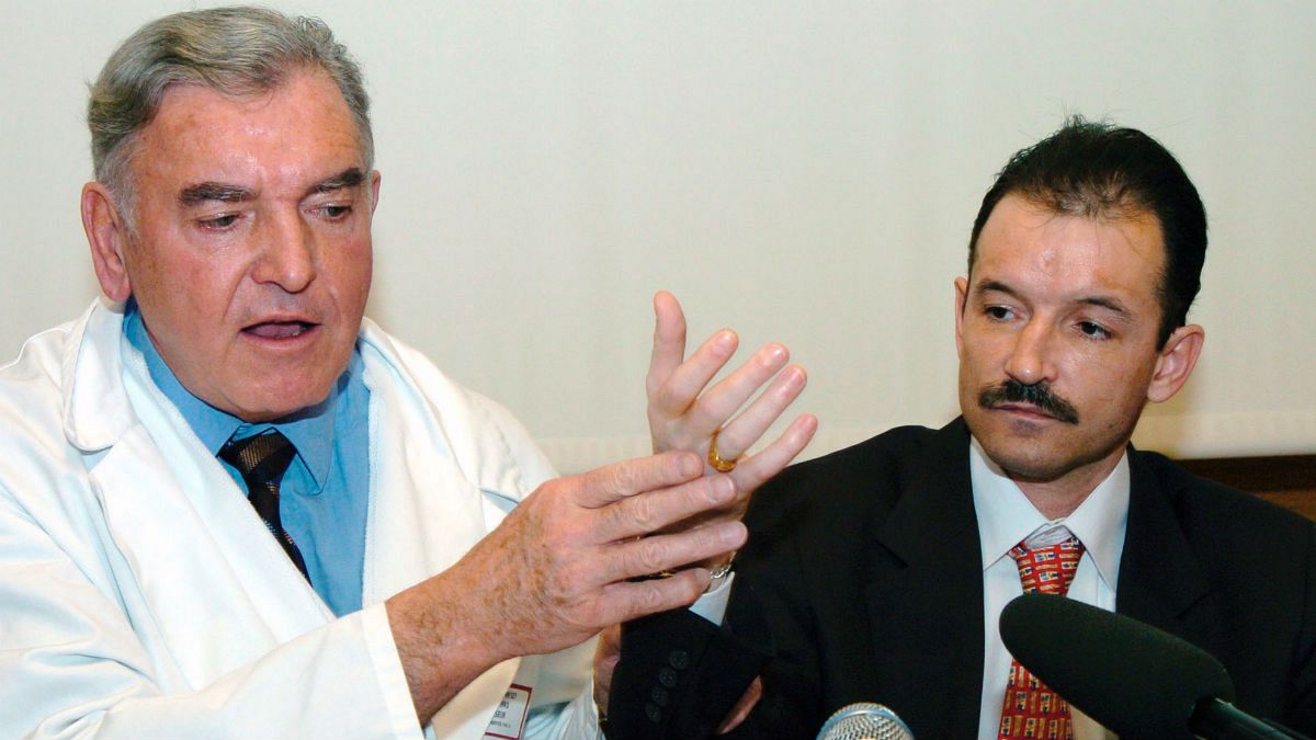 French Dr. Jean-Michel Dubernard, left, and France's Denis Chatelier hold a press conference at the Edouard Herriot hospital in Lyon, central France, Thursday, Jan.13, 2005