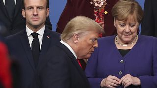 U.S. President Donald Trump, center, French President Emmanuel Macron, left, and German Chancellor Angela Merkel at a NATO summit on Dec. 4, 2019.
