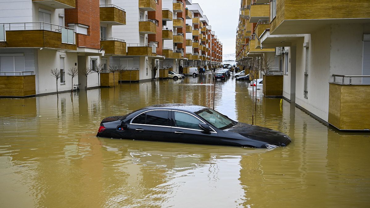A car submerged on a flooded street in the town of Fushe Kosove after heavy rain and snow showers in Kosovo. January 11, 2021