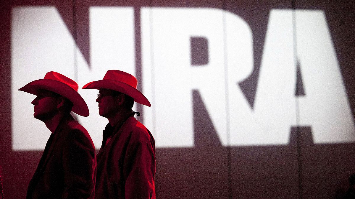 In this May 4, 2013, file photo, National Rifle Association members listen to speakers during the NRA's Annual Meetings and Exhibits in Houston, Texas.