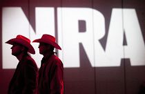 In this May 4, 2013, file photo, National Rifle Association members listen to speakers during the NRA's Annual Meetings and Exhibits in Houston, Texas.
