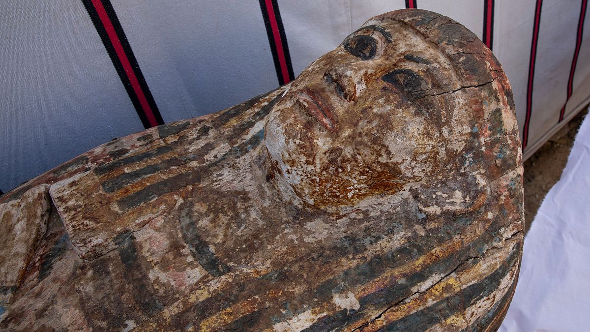 An ancient coffin unearthed in a vast necropolis filled with burial shafts, coffins and mummies dating back to the New Kingdom 3000 BC, Monday, Jan. 17, 2021, in Saqqara, sout