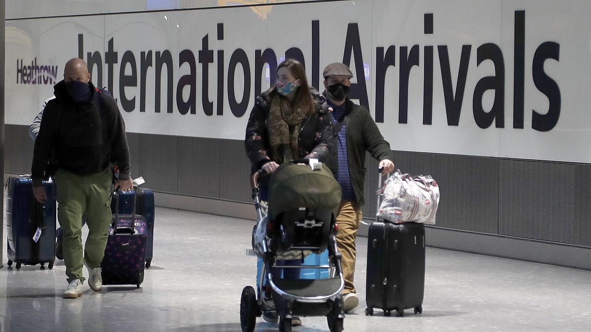 Travellers arrive at Heathrow Airport in London, Sunday, Jan. 17, 2021. Thousands of EU citizens were turned away from the UK border in the first quarter of 2021.