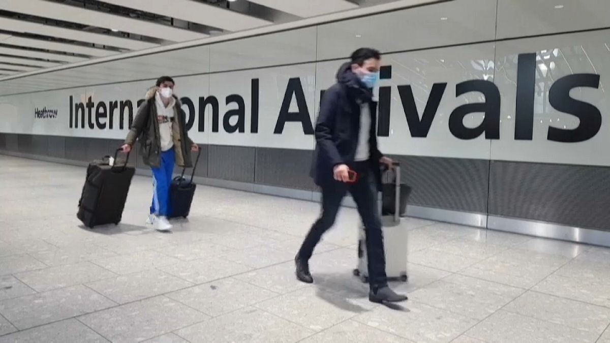 Passengers arrive at Heathrow airport the day before the UK government closes all travel corridors