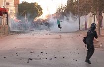 Police firing tear gas canisters, protesters throwing objects