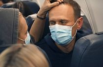 Alexei Navalny and his wife Yulia sit on the plane on a flight to Moscow, at the Airport Berlin Brandenburg (BER) in Schoenefeld, near Berlin