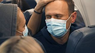 Alexei Navalny and his wife Yulia sit on the plane on a flight to Moscow, at the Airport Berlin Brandenburg (BER) in Schoenefeld, near Berlin