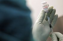 A member of staff at the university hospital prepares the Moderna vaccine against COVID-19 in Duesseldorf, Monday, Jan. 18, 2021.
