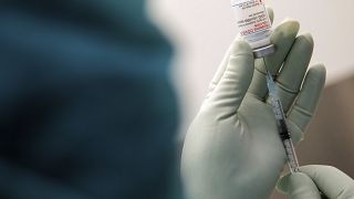 A member of staff at the university hospital prepares the Moderna vaccine against COVID-19 in Duesseldorf, Monday, Jan. 18, 2021.