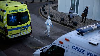 Ambulances parked outside the COVID-19 emergency ward at the Santa Maria hospital in Lisbon