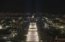 The U.S. Capitol building is seen as the "Field of Flags" are illuminated on the ground on the National Mall ahead of the inauguration ceremonies, Washington DC, Jan. 18, 2021
