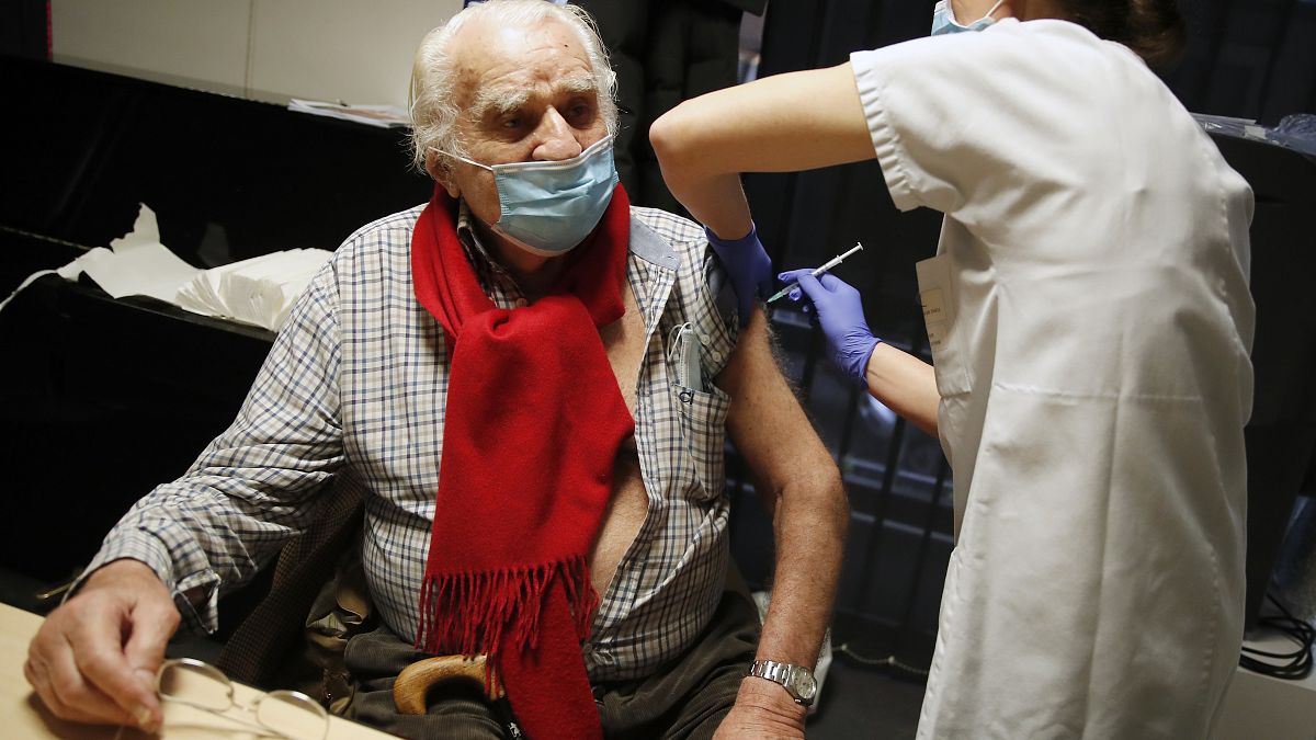 Mr Albert from Paris, 94 years old, receives the Pfizer-BioNTech vaccine against COVID-19 at a vaccination centre in Paris, Jan. 18, 2021. 