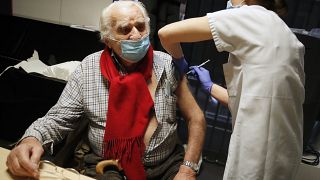 Mr Albert from Paris, 94 years old, receives the Pfizer-BioNTech vaccine against COVID-19 at a vaccination centre in Paris, Jan. 18, 2021. 