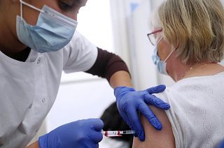 Michelle Wecxsteen, 83, receives the Pfizer-BioNTech vaccination against COVID-19 at Dron hospital in Tourcoing, northern France, Tuesday, Jan. 19, 2021.