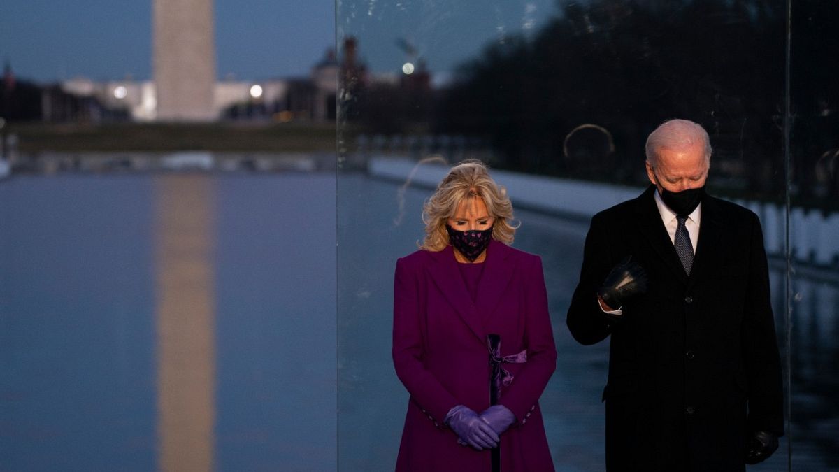 President-elect Joe Biden and his wife Jill Biden participate in a COVID-19 memorial event at the Lincoln Memorial Reflecting Pool, Tuesday, Jan. 19, 2021, in Washington