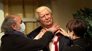 Staff removing the head of the Donald Trump waxwork