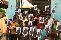 Villagers holding Kamala Harris's posters