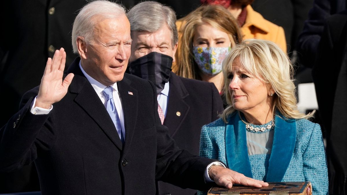 Joe Biden is sworn in as the 46th president of the United States as Jill Biden holds the Bible. U.S. Capitol in Washington, Wednesday, Jan. 20, 2021.