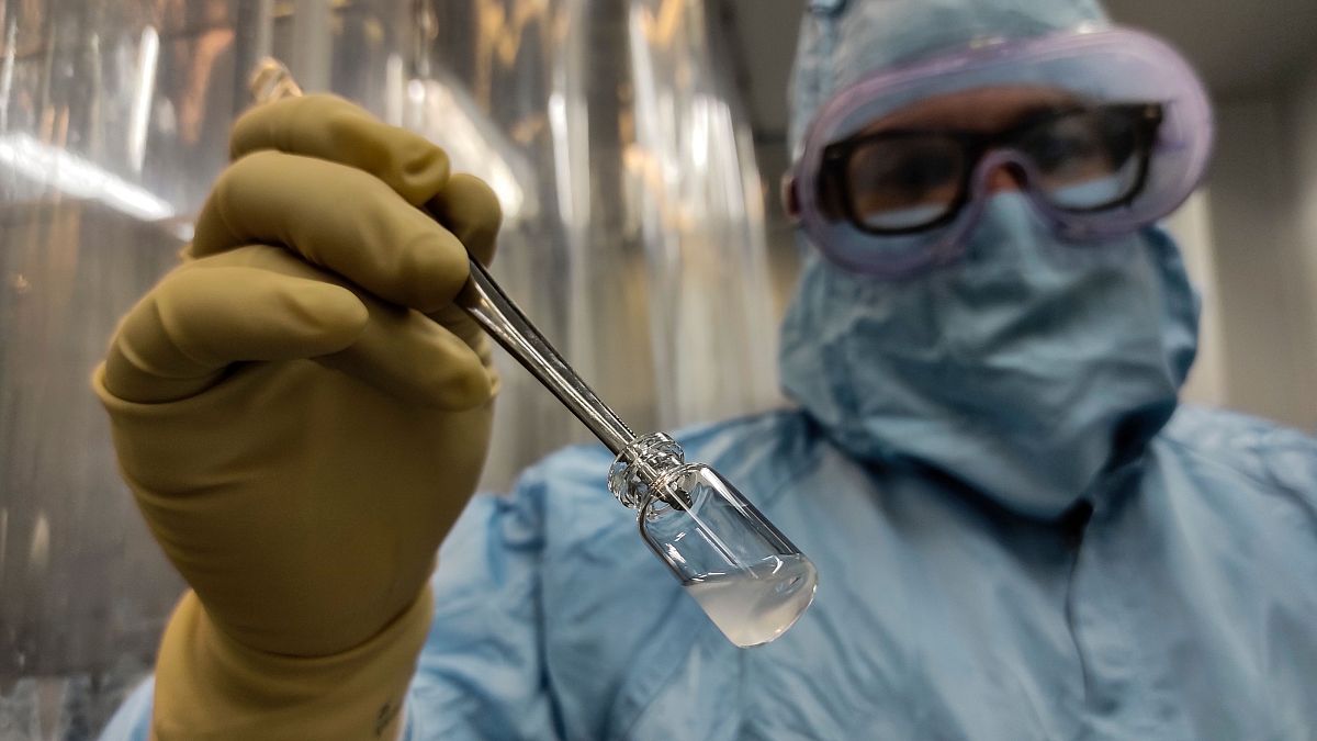 A technician shows a vial of the Cuban made COVID-19 vaccine called Soberana 2