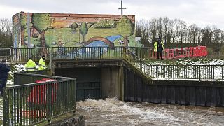 Environment Agency workers flood a storm basin near the River Mersey in Didsbury, north west England, to view flood defences put in place for Storm Christoph, Jan. 21, 2021.