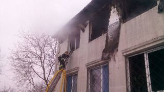 Pictures showed firefighters tackling smoke from burned-out rooms