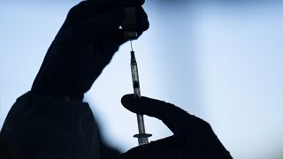 A medical staff member prepares the Pfizer-BioNTech COVID-19 vaccine on Thursday, Jan. 21, 2021.