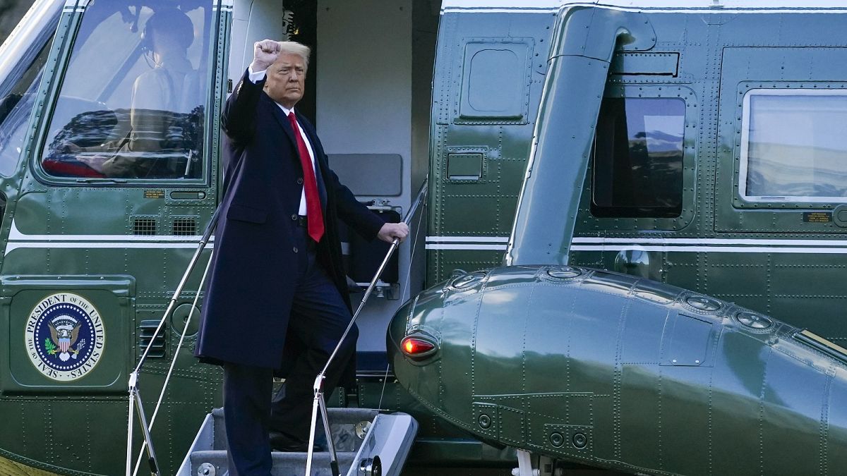 President Donald Trump gestures as he boards Marine One on the South Lawn of the White House, Wednesday, Jan. 20, 2021, in Washington DC.