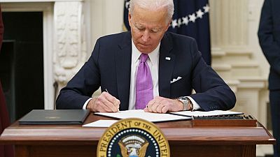 US President Joe Biden signs executive orders as part of the Covid-19 response