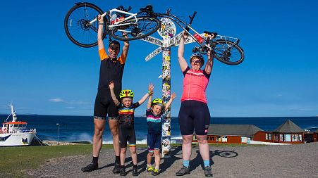 Katie, Tom and their children at John O'Groats.