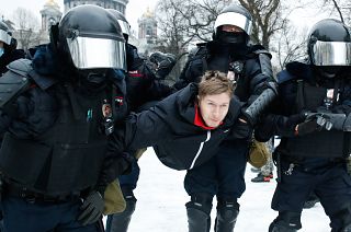 Police detain a man during a protest against the jailing of opposition leader Alexei Navalny in St. Petersburg, Russia. January 23, 2021