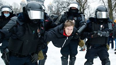 Police detain a man during a protest against the jailing of opposition leader Alexei Navalny in St. Petersburg, Russia. January 23, 2021