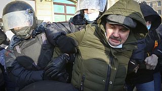 Police detain a man during a protest against the jailing of opposition leader Alexei Navalny in Moscow, Russia, Saturday, Jan. 23, 2021.