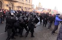 Riot police beat, detain pro-Navalny protesters.