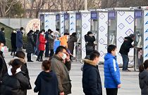Beijing residents being tested for Covid-19 at a mass testing site.
